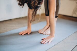 forward fold on a yoga mat
