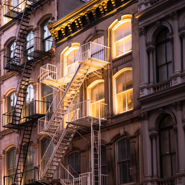 New York City apartments lit up in a golden light