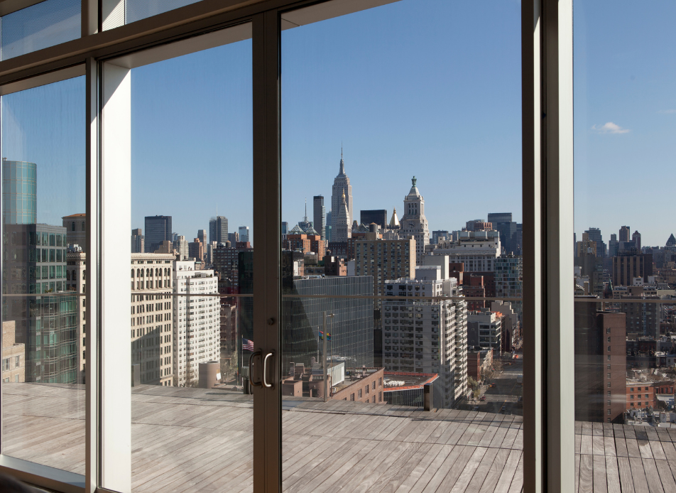 Apartment in New York City with a beautiful view representing one of the benefits of New York City Life. Access the Therapy in NYC can also help navigate city life.