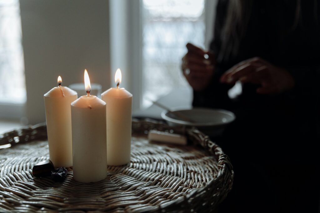 Candles burning during a meditation session. Self-Care is a key component of Anxiety Therapy for Women in Manhattan, NY.