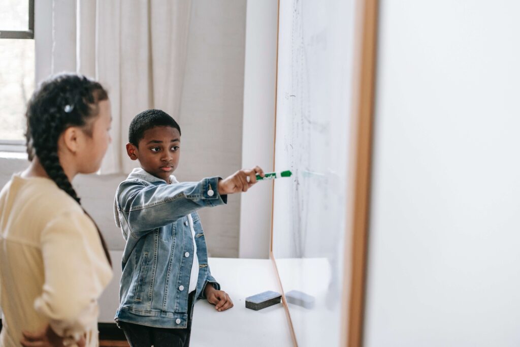 A young neurodiverse child works closely with a special Ed teacher. Learn more about available resources for Special Needs Parenting in Manhattan, NY.