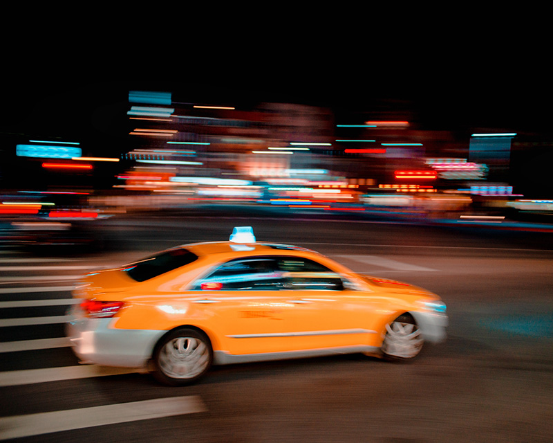 Taxi rushing through the streets of NYC