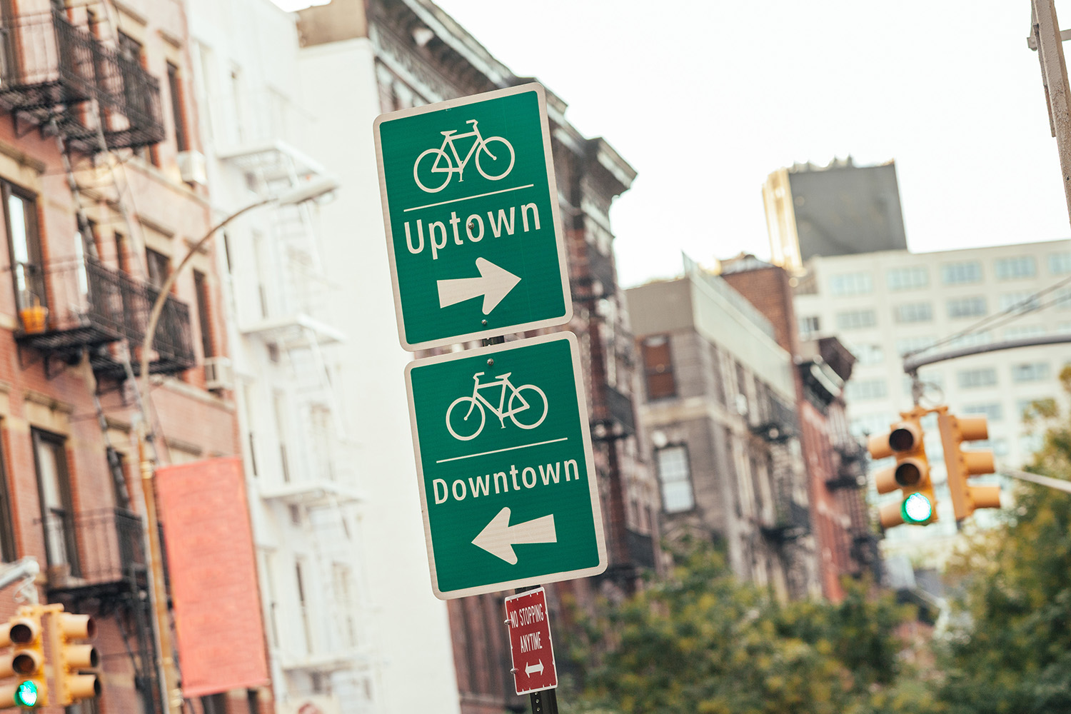 Sign for uptown and downtown; Therapy for NYC living