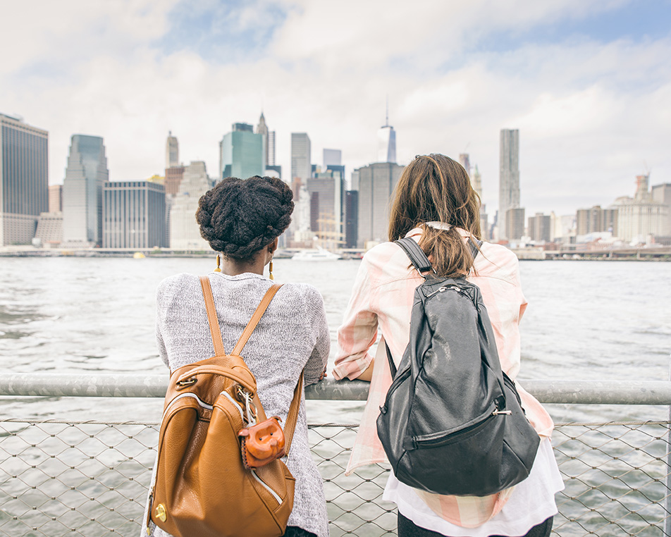 Two friends looking at NYC skyling