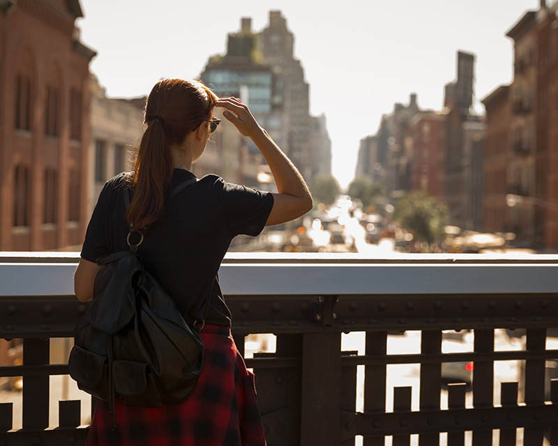 Young woman in NYC looking at the city